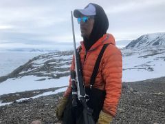 07A One Of Our Local Guides Carries A Rifle For Protection From Polar Bears On Bylot Island On Day 3 Of Floe Edge Adventure Nunavut Canada